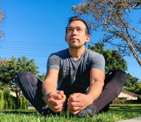 Rincon stretches before a run Nov 13., 2020 at Liberty Park in Lakewood, CA. Although he enjoys HIT-based workouts and weightlifting, he also runs regularly to stay in shape.