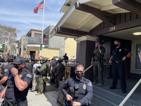 HBPD defends their Walnut Avenue substation after escorting a right-wing agitator to safety. A crowd gathered out front before moving towards Main Street on April 11, 2021.