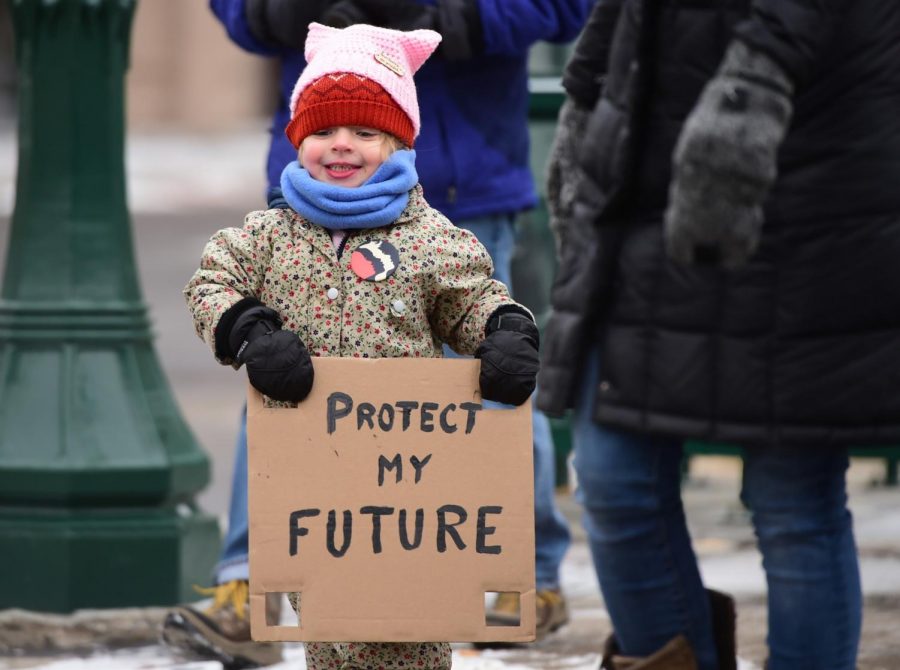 Ingrid Holweger, 3, of Syracuse during the Syracuse Women's March. About 150 people marched to the University United Methodist Church from the James M. Hanley Federal Building, Sat. Jan. 18, 2020, Syracuse, N.Y.