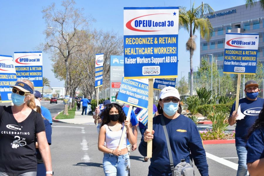 Healthcare workers protest for fair compensation outside the Kaiser in Downey on March 30, 2021. Union leaders from the OPEIU Local 30 and the SEIU-UHW peacefully protested for the Heros Bonus Kaiser promised. 