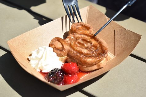 "D-lish" marketplace prepares their "Very Very Berry Mickey Waffle" at the California Adventure Park on April 16, 2021. The marketplace serves the waffle during the "Touch of Disney" event.