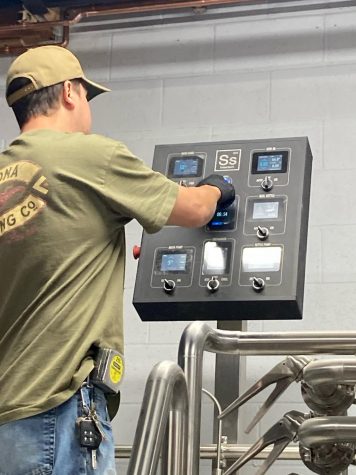 Derek Johnstone testing his new equipment. He began brewing 10 years ago in his home with friend and co-owner Jason Sullivan.