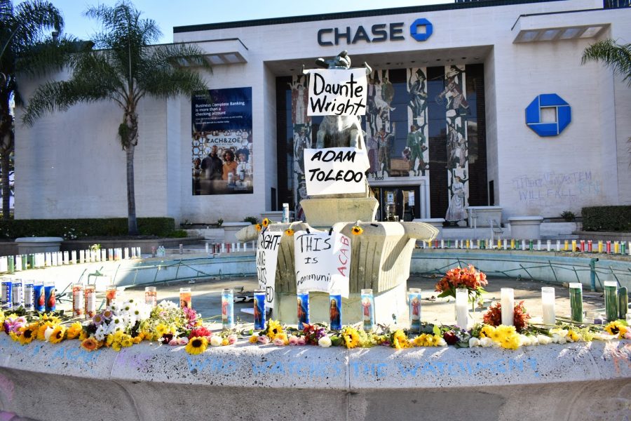 Activists+make+a+candlelight+vigil+for+Adam+Toledo+and+Daunte+Wright+in+West+Hollywood.+People+pass+by+and+paid+their+respects+on+April+18%2C+2021.