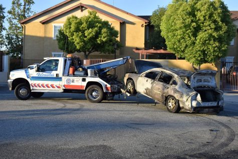 Vernola's Towing Service takes the vehicle to their yard, where it will later be disposed in a junk yard. The Chevy sedan burns after a speaker caught fire in the vehicle's trunk on April 29, 2021.