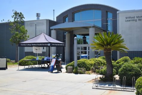 A pre-health screening check-in site is established outside the Cerritos College library on August 9, 2021. They ensure that students have no symptoms of COVID-19 and did not come into contact with people who have the virus. 