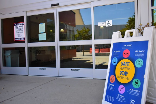 Signs are placed outside Cerritos College buildings and facilities on August 9, 2021. They remind students to wear a mask and follow health and safety guidelines.
