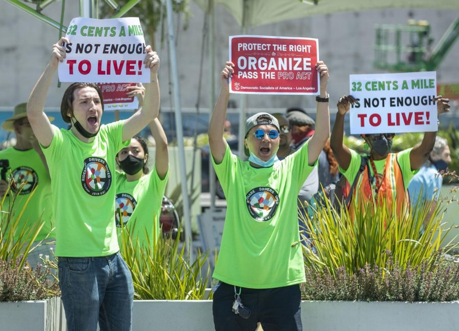Proposition 22 faces a potentially long legal battle after a judge called the gig-worker law unconstitutional. Above, ride-hailing drivers and organizers rallied at a drivers strike at the Los Angeles International Airport in July. Photo credit: Mel Melcon/Los Angeles Times/TNS