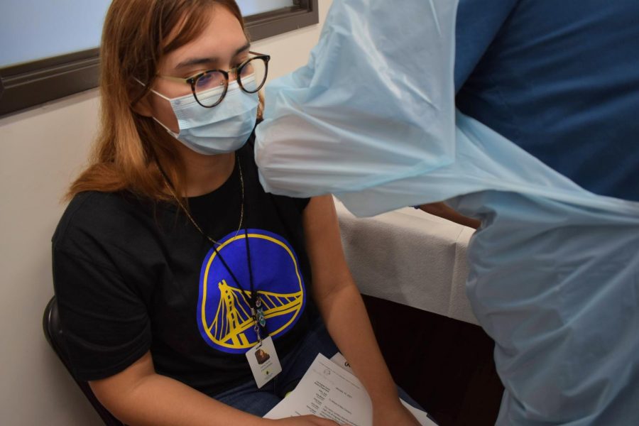 Cerritos College is offering the COVID-19 vaccine, Moderna, to students ahead of the college vaccine mandate on September 30, 2021. Daisy Sotis receives her COVID-19 vaccine at Wesley Health Center. 