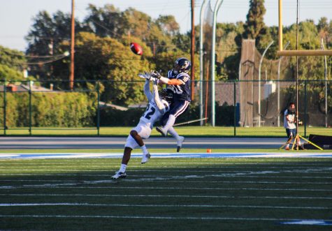Falcons Wide Receiver Bailey Torres Jumps up in an attempt to make the catch. He is in coverage against a Fullerton Defensive back during the game on Sept. 11, 2021. 
