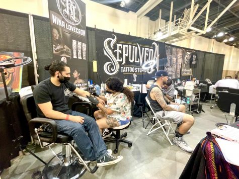 Booth for Sepulveda Tattoo Studio that specializes in custom original tattoos. Nina Lovecrow tattooing her client, her speciality is also fine line tattoos, photographed on Sept. 19, 2021.