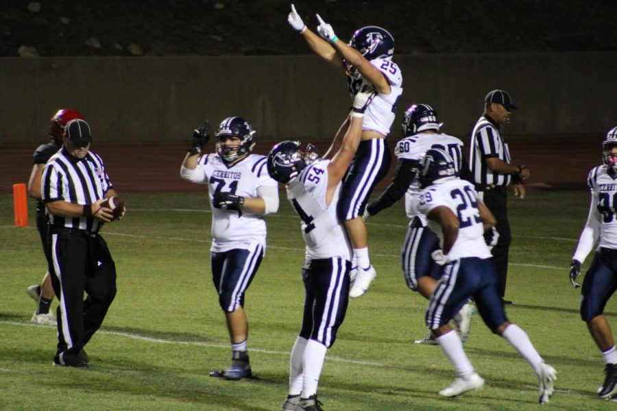 Falcons RB Penieli Lauago (#25) is lifting into the air by OL Jonathan Manzo (#54). Penieli caught a 37-yard touchdown pass to give the Falcons at 33-17 lead in the 4th quarter of their game at Chaffey College on October 16th. 