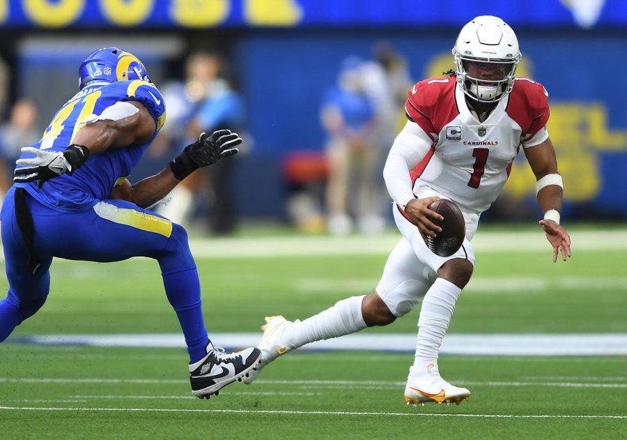 Arizona Cardinals quarterback Kyler Murray scrambles for a first down against Los Angeles Rams linebacker Kenny Young in the second quarter at SoFi Stadium on Sunday, Oct. 3, 2021 in Inglewood, California. (Wally Skalij/Los Angeles Times/TNS)