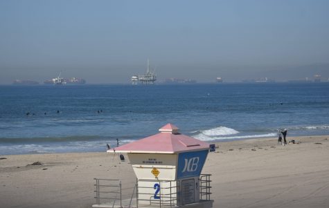 Huntington Beach lifeguard tower two overlooks an oil drilling site. The beach reopened after a drilling site off the coast released about 126,000 gallons of oil into the water on Oct. 3, 2021. 
