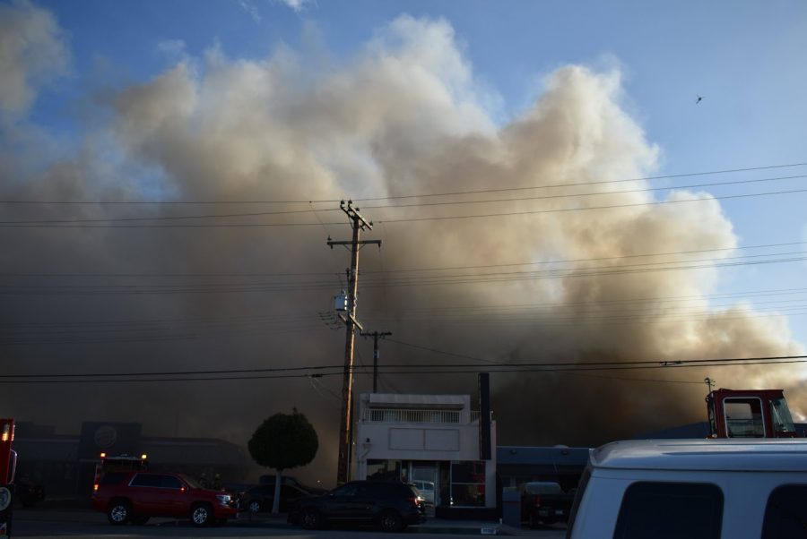 Smoke billows out of an Extra Space Storage facility in Bellflower. LA County fire department declares the blaze a third-alarm fire on Nov. 9, 2021. 