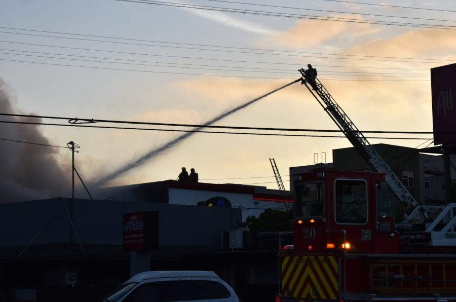 LA County fire crews continue to use a defensive-fire-attack to extinguish the blaze. Firefighters worked into the late afternoon to put out the fire in the Bellflower storage facility on Nov. 9, 2021. 