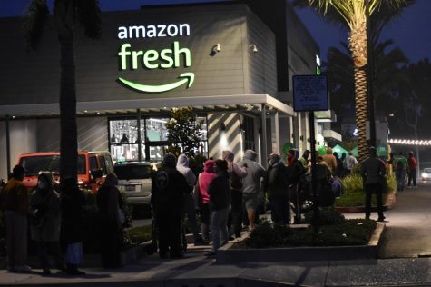Hundreds of people waited in line to get the grand-opening day savings at Amazon Fresh in Cerritos. The ninth amazon grocery store in California opened on Nov. 18, 2021. 
