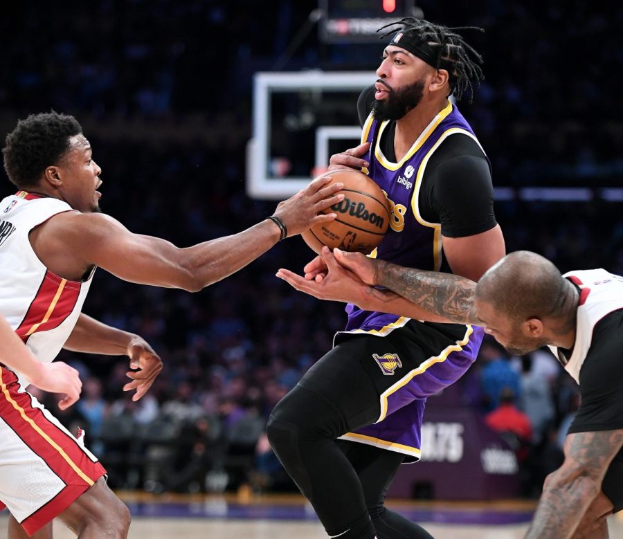 The Los Angeles Lakers Anthony Davis has the ball knocked away by the Miami Heats P.J. Tucker, right, with help with Kyle Lowry, left, in the second quarter at Staples Center on Wednesday, Nov. 10, 2021, in Los Angeles. (Wally Skalij/Los Angeles Times/TNS)