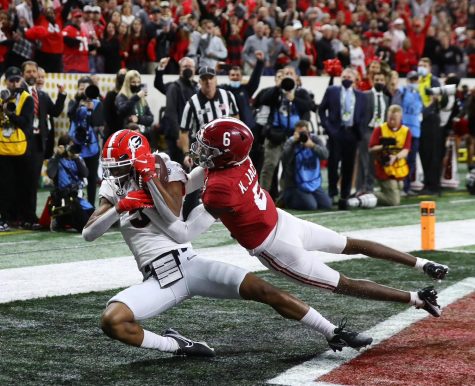 Georgia wide receiver Adonai Mitchell catches the go-ahead touchdown against Alabama defensive back Khyree Jackson to take a 19-18 lead during the 4th quarter in the College Football Playoff Championship game on Monday, Jan. 10, 2022, in Indianapolis. (Curtis Compton/Atlanta Journal-Constitutional/TNS)
