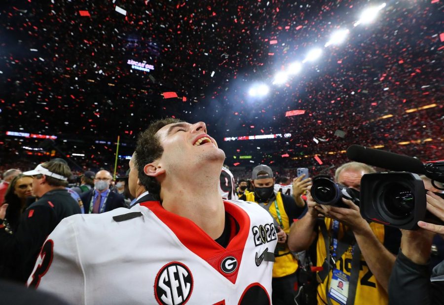 Stetson Bennett relishes the moment as the confetti flies, winning the College Football Playoff Championship game on Monday, Jan. 10, 2022, in Indianapolis. Photo credit: Curtis Compton/The Atlanta Journal-Constitution/TNS