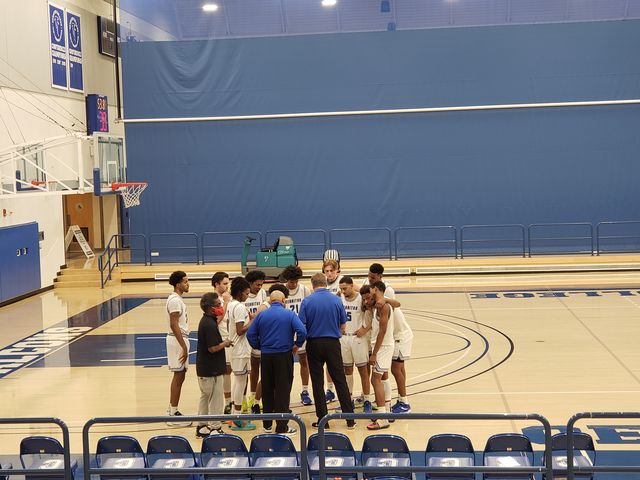 The Cerritos Falcons called a timeout and are discussing their next moves.