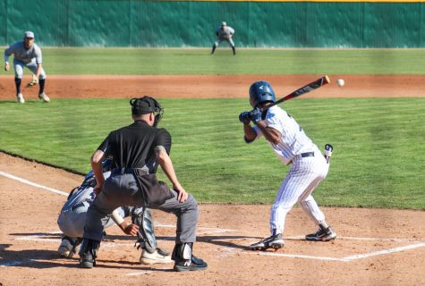 Freshman, left fielder, No. 7, Julian Francois at the plate, at the bottom of the first, against the Lasers in his first at-bat. Francois would hit a triple on his first plate appearance and spark momentum for the Falcons on Thursday, Feb. 3, 2022.