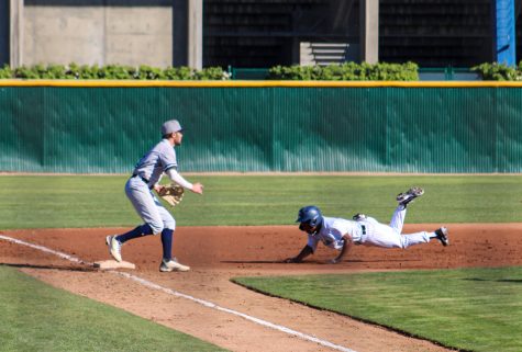 Freshman, left fielder, No. 7, Julian Francois slides to third base. He is safe in his first at-bat at the bottom of the first inning against Irvine Valley College on Thursday, Feb. 3, 2022