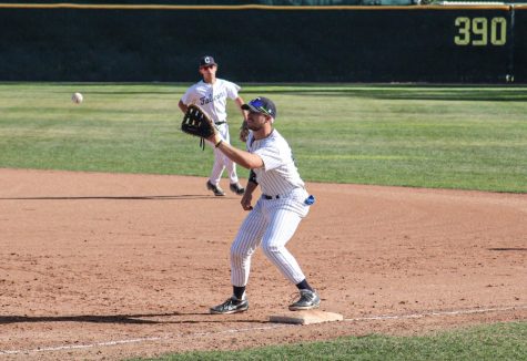 Freshman, first basemen, No. 44, Sawyer Chesley stands on the plate prepared to make the catch to get the runner out at first. He started the game but would later be taken out in the seventh inning against Santa Ana on Feb. 8, 2022.