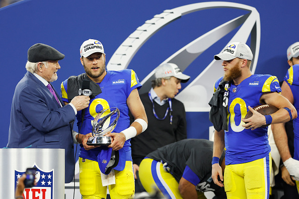 INGLEWOOD, CALIFORNIA - JANUARY 30: Matthew Stafford #9 of the Los Angeles Rams speaks to Terry Bradshaw while holding the George Halas Trophy as Cooper Kupp #10 looks on after defeating the San Francisco 49ers in the NFC Championship Game at SoFi Stadium on January 30, 2022 in Inglewood, California. The Rams defeated the 49ers 20-17. (Photo by Christian Petersen/Getty Images)