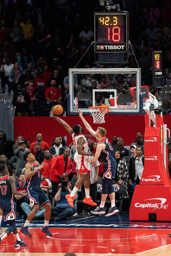 This is an image of James Harden in a Houston Rockets Uniform (which Harden is now a 76er) and the image was taken by All-Pro Reels. Harden was dunking over Davis Bertans and the game took place on Oct. 30th, 2019 when the Rockets played the Wizards. 