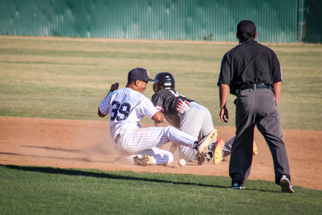 Freshman third baseman, No. 39, Delvan Gomez who was plugged in at second base attempting to Tagout Compton shortstop No.11, Sevon Battle. Battle successfully steals second base against the Falcons as he would be the only runner scored for the Tartars in their 8-1 loss against Cerritos at home on March. 8, 2022.