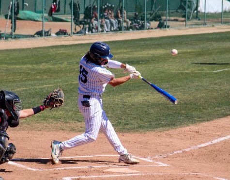 Sophomore shortstop, No. 15, Andy Vega singles to left field in the bottom of the third inning against the Tartars. Vega would score on a balk to put the Falcons up 2-0 at home against Compton on March. 12, 2022.