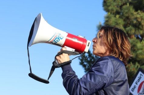 Cerritos College faculty and staff marched along the campus chanting and waving signs fighting for a fair college with the Board.