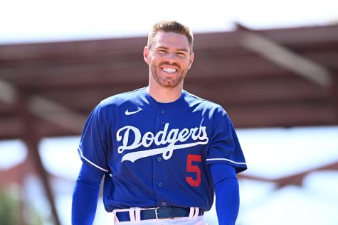 GLENDALE, ARIZONA - MARCH 22: Freddie Freeman #5 of the Los Angeles Dodgers walks to the dugout against the Cincinnati Reds during a spring training game at Camelback Ranch on March 22, 2022 in Glendale, Arizona. (Photo by Norm Hall/Getty Images)
