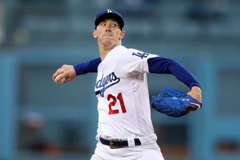LOS ANGELES, CALIFORNIA - OCTOBER 12: Walker Buehler #21 of the Los Angeles Dodgers pitches against the San Francisco Giants during the first inning in game 4 of the National League Division Series at Dodger Stadium on October 12, 2021 in Los Angeles, California. (Photo by Ronald Martinez/Getty Images)