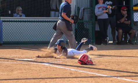 Outfielder No. 4, Alyssa Capps slides home as Leduc singled for 2 RBI's as Capps scores the seventh run of the game for Cerritos. Capps who pinch ran, stole second would celebrate coming back to the dugout with her teammates.