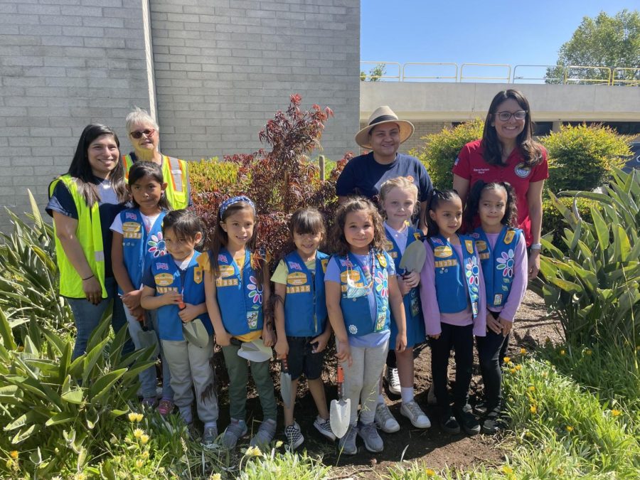 Mayor Blanca Pacheco stands with Catherine Alvarez, volunteers and girl scouts after finishing planting a Japanese maple tree at Downey city hall. Photo credit: Silas Bravo