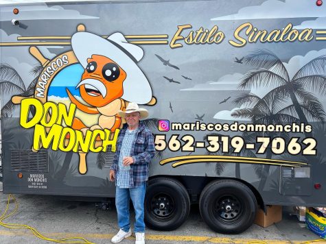 Elizabeth Lopez’s grandpa, Ramon “Monchis” Lopez, standing in front of the food truck that is honored in his name. 