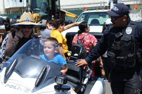 Police officers at the event gave children the opportunity to allow them to ride the motorbike, as well as turn on the siren. Photo credit: Darryl Linardi