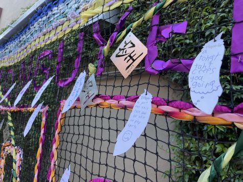 The definitions of hope written on feathers by local Downey residents on Nguyen’s art piece.