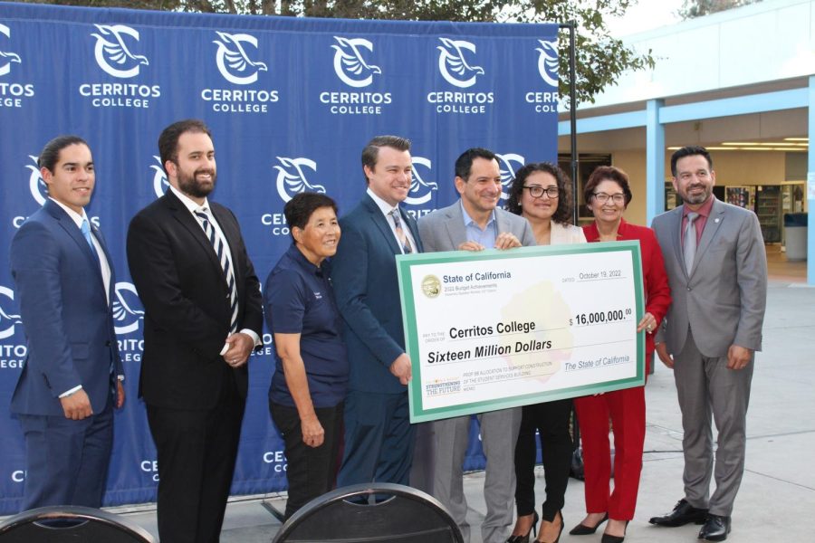 Dr. Fierro and the board of trustees are posing with the $16 million dollars from Anthony Rendon that would help finish construction on the Student Services Building.