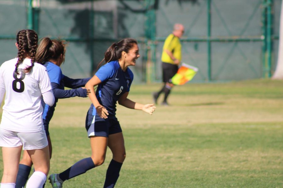 Lissette Saucedo (No. 6) scores her first goal and laughs with her teammates as the Falcons stomp ELAC 7-0 on Nov. 4. 