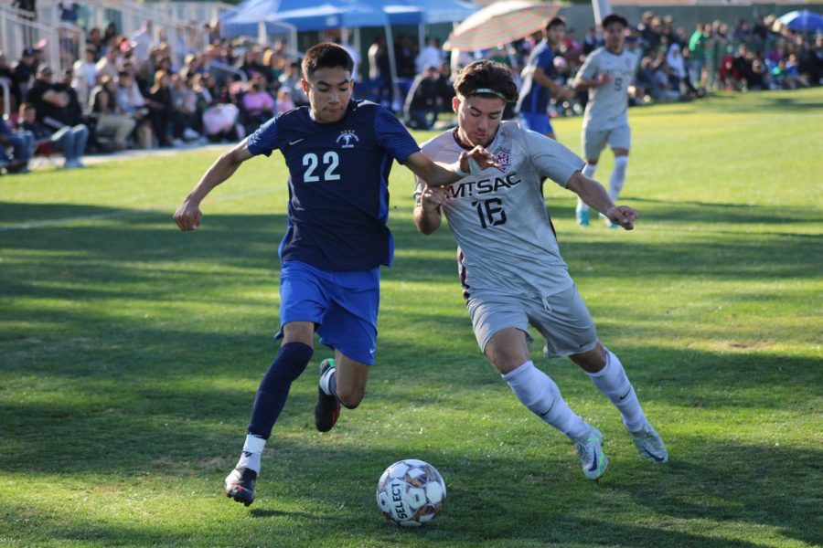 Michael Rodriguez (No. 22), Sophomore, Forward, looks to shed the Mt. Sac defender as he tries to set up a Falcon score on Nov. 26. 