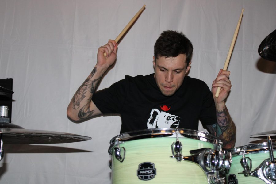 Scott Collins focused on drums