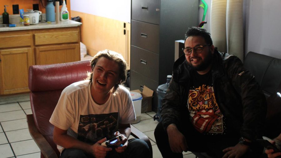 (Left to Right) Josh Buckley (Bassist) and Sunny Shrestha (Guitarists) laugh as the rest of the band joke around and listen to one of the rifts Josh showed on YouTube.