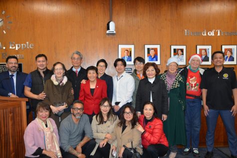 Trustee Shin Liu posing with community members following her election as Board President on Dec. 7 at 7 p.m. 