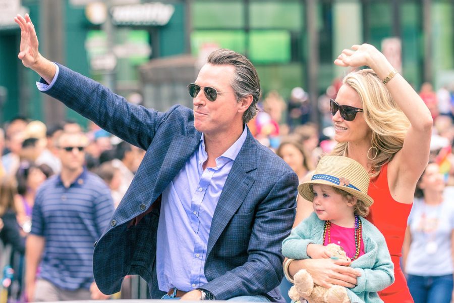 Gavin Newsom poses with his family during the San Francisco Pride event in 2015 as he meets with members attending the event. 