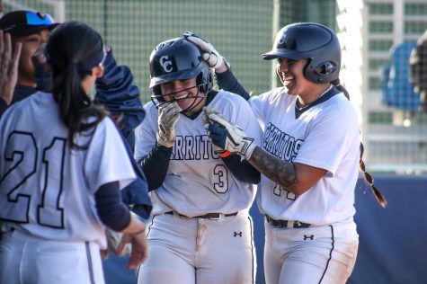 Miranda Diaz No. 14, celebrates with her teammate Brooklyn Bedolla No. 3, the walk-off 9-1 mercy rule against Southwestern securing their first home win of the season on Feb. 15, 2023. 