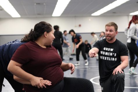 Heres Womens Wrestling Head Coach Dustin Kirk showing Katherine Aquino (Frosh) how to escape a certain takedown with her arms on Feb. 22. 