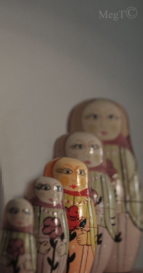 Russian Nesting dolls used to represent the middle child by putting the one in the middle right in the spot light. 