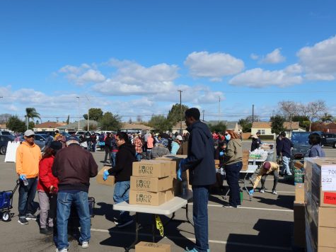The volunteers, wearing blue latex gloves, helping distribute food and helping recipients take the food back to their cars on Feb. 22 in the Cerritos College Parking Lot 1.